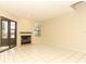 Spacious living room with tiled flooring, a fireplace, and a glass sliding door to an outdoor patio at 559 Northbridge Dr, Altamonte Springs, FL 32714