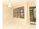 Bright living room featuring tiled floors, a cozy fireplace, and access to a screened-in porch at 559 Northbridge Dr, Altamonte Springs, FL 32714