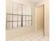A well-lit room features white tile flooring and a large window with blinds at 559 Northbridge Dr, Altamonte Springs, FL 32714