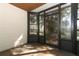 Sunroom with tile floors and views of backyard foliage at 559 Northbridge Dr, Altamonte Springs, FL 32714