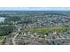 Panoramic aerial view of the community featuring a lush green space winding throughout the neighborhood at 647 Ella Mae Dr, Davenport, FL 33897