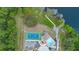 Overhead shot of community pool, tennis courts, and lake access at 647 Ella Mae Dr, Davenport, FL 33897