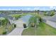 Beautiful home with a well-manicured lawn, mature trees, and a two-car garage at 647 Ella Mae Dr, Davenport, FL 33897