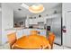 Bright kitchen with white cabinetry, stainless steel appliances, and tiled flooring at 647 Ella Mae Dr, Davenport, FL 33897
