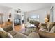 Inviting living room with neutral decor, hardwood floors, and seamless access to lanai at 647 Ella Mae Dr, Davenport, FL 33897