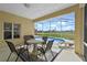Relaxing screened-in patio with a pool view, perfect for outdoor dining and entertaining guests at 647 Ella Mae Dr, Davenport, FL 33897