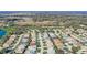 Aerial view of homes in the community, featuring a golf course in the distance at 7233 Se 171St Pond Ln, The Villages, FL 32162
