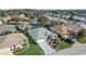 Aerial view of homes in the community, featuring manicured lawns and mature trees at 7233 Se 171St Pond Ln, The Villages, FL 32162