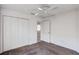 Standard-size bedroom featuring a ceiling fan, carpeting and closet at 7233 Se 171St Pond Ln, The Villages, FL 32162