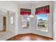 Bright dining area with tile flooring, complemented by natural light from large windows at 7233 Se 171St Pond Ln, The Villages, FL 32162