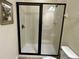 Modern bathroom with a glass-enclosed shower and neutral tile at 7668 Wilmington Loop, Kissimmee, FL 34747