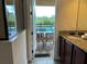 This bathroom features views of the private pool at 7668 Wilmington Loop, Kissimmee, FL 34747