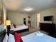 Comfortable bedroom featuring twin beds, a dresser, and TV at 7668 Wilmington Loop, Kissimmee, FL 34747