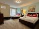 Cheerful bedroom with twin beds, bright art, and Mickey Mouse pillows at 7668 Wilmington Loop, Kissimmee, FL 34747