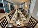 Large dining room with seating for many guests at 7668 Wilmington Loop, Kissimmee, FL 34747