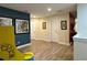 Bright game room showcasing a Pac-Personal arcade game and hardwood floors at 7668 Wilmington Loop, Kissimmee, FL 34747