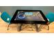 Entertainment space featuring a digital game table with blue chairs at 7668 Wilmington Loop, Kissimmee, FL 34747