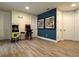 Spacious game room featuring two arcade games, bar stools, and decorative wall art at 7668 Wilmington Loop, Kissimmee, FL 34747