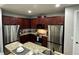 Well-equipped kitchen with granite countertops, stainless appliances, and plenty of storage space at 7668 Wilmington Loop, Kissimmee, FL 34747
