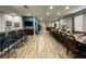 Open concept living space with a large dining area, kitchen, and cozy seating at 7668 Wilmington Loop, Kissimmee, FL 34747