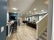 Expansive living space with multiple seating areas, a dining table, and a modern kitchen at 7668 Wilmington Loop, Kissimmee, FL 34747