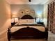 This main bedroom is complete with lamps, a ceiling fan, and framed pictures for a relaxing retreat at 7668 Wilmington Loop, Kissimmee, FL 34747