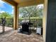 Outdoor patio with a stainless steel grill and view of the yard at 7668 Wilmington Loop, Kissimmee, FL 34747