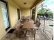 Inviting outdoor patio area with dining tables, perfect for entertaining guests or enjoying al fresco meals at 7668 Wilmington Loop, Kissimmee, FL 34747