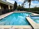 Beautiful backyard pool and spa with tropical landscaping at 7668 Wilmington Loop, Kissimmee, FL 34747