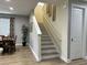 Open staircase connecting multiple floors, next to dining area and with decor at 7668 Wilmington Loop, Kissimmee, FL 34747