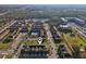 Aerial view of a community with townhomes, a pool, and landscaped green spaces at 9819 Red Eagle Dr, Orlando, FL 32825