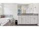 A bathroom featuring double sinks and vanity with a large tub at 9819 Red Eagle Dr, Orlando, FL 32825