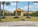 Exterior view of the community clubhouse, showcasing landscaping and the building's facade at 9819 Red Eagle Dr, Orlando, FL 32825