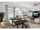 Open dining area with a modern table, chairs, and sliding glass door to the outdoors at 9819 Red Eagle Dr, Orlando, FL 32825