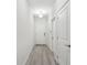 Bright hallway with wood-look floors leads to the main living area at 9819 Red Eagle Dr, Orlando, FL 32825
