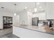 Spacious kitchen features an extended island, modern lighting, and stainless steel appliances at 9819 Red Eagle Dr, Orlando, FL 32825