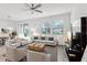 Bright living room featuring neutral tones, comfortable seating, and ample natural light at 9819 Red Eagle Dr, Orlando, FL 32825