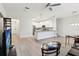 Open-concept living space with a large island, pendant lighting, and stainless steel appliances at 9819 Red Eagle Dr, Orlando, FL 32825