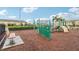 Community playground with climbing features, a slide, monkey bars, and a bench at 9819 Red Eagle Dr, Orlando, FL 32825