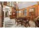 Charming dining room with wood-paneled walls, a spiral staircase, and unique light fixture at 10301 Us Highway 27 # 114, Clermont, FL 34711