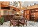 Dining room features wood paneled walls, chandelier and an open concept to the living room at 10301 Us Highway 27 # 114, Clermont, FL 34711