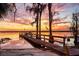 Picturesque lake pier at sunset, offering a tranquil spot for relaxation and nature viewing at 10301 Us Highway 27 # 114, Clermont, FL 34711