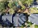 Aerial shot of the house showcasing the roof and the proximity to trees and greenery at 1055 Kensington Park Dr # 503, Altamonte Springs, FL 32714