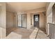 Covered porch with tiled flooring, leading to the main entrance with glass accents at 1055 Kensington Park Dr # 503, Altamonte Springs, FL 32714