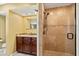 Bathroom featuring a tiled shower, vanity with dark wood cabinets and a light countertop at 1055 Kensington Park Dr # 503, Altamonte Springs, FL 32714