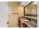 Bathroom featuring granite countertop and a round window above the sink at 1055 Kensington Park Dr # 503, Altamonte Springs, FL 32714