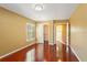 A bedroom with hardwood floors, a closet, and a window at 1055 Kensington Park Dr # 503, Altamonte Springs, FL 32714