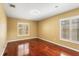 Bedroom featuring hardwood floors and windows at 1055 Kensington Park Dr # 503, Altamonte Springs, FL 32714