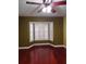 Bedroom featuring hardwood floors and a window with shutters at 1055 Kensington Park Dr # 503, Altamonte Springs, FL 32714