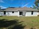 Backyard featuring newly installed lawn and stucco exterior walls at 12913 Sw 82Nd Avenue Rd, Ocala, FL 34473